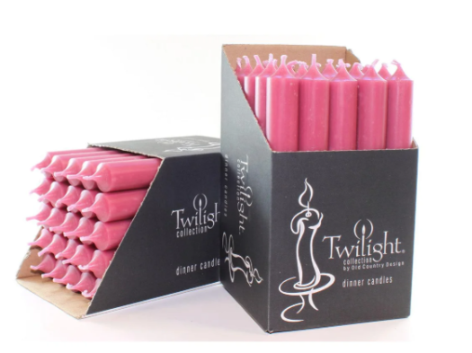 Pink candles in a Twilight collection box on a white background