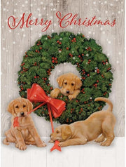 Christmas card with puppies and a wreath on a wooden background