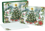 Christmas-themed greeting card with a tree and presents in a snowy village scene, featuring a matching envelope.