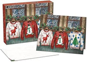 Set of Christmas-themed sweaters in packaging with a wooden window background