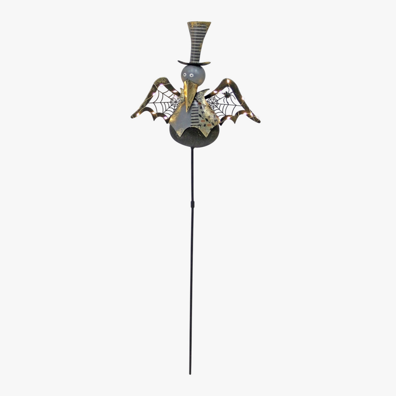 Decorative garden stake with a spider design on a white background