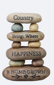 Stack of stones with engraved text on a white background