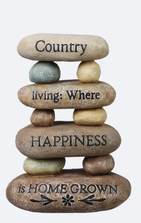Stack of stones with engraved text on a white background