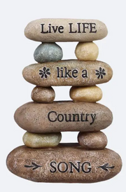 Stack of stones with engraved text on a white background