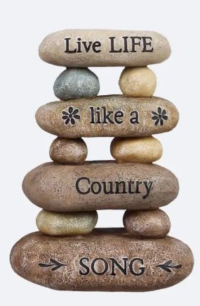 Stack of stones with engraved text on a white background