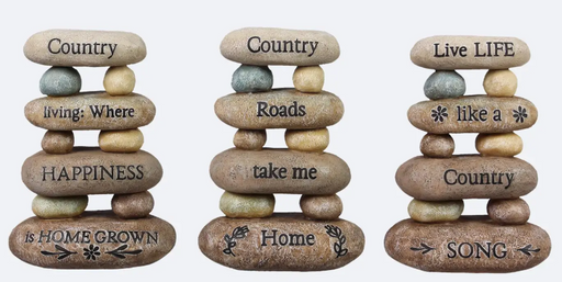 Three stone stacks with engraved phrases on a white background