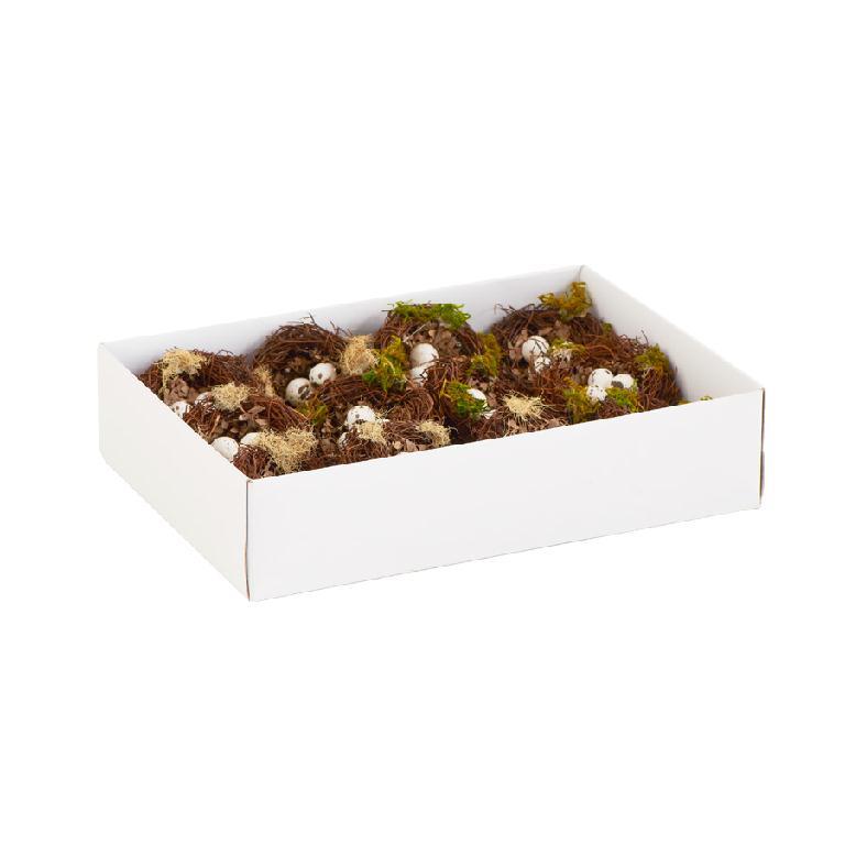 Box of decorative eggs and moss on a white background