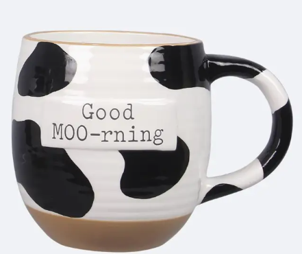 Cow print mug with 'Good MOO-rning' text on a white background