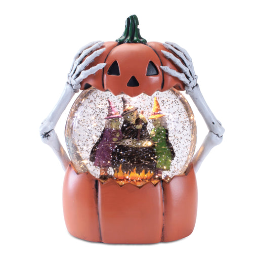 Halloween-themed snow globe with a pumpkin base, skeleton hands, and a witch inside.