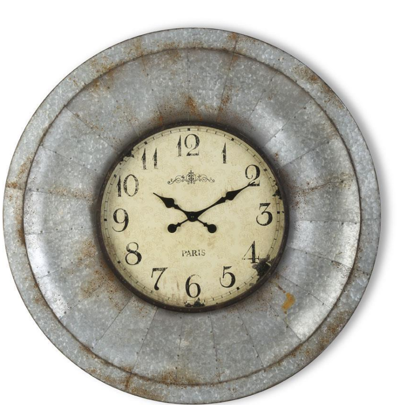 Round wall clock with metal frame on a white background
