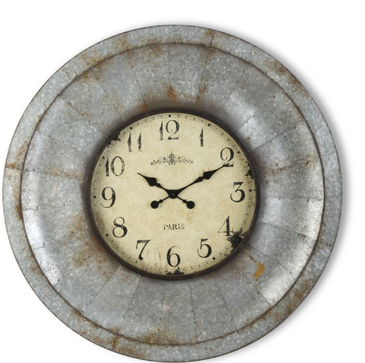 Round wall clock with metal frame on a white background