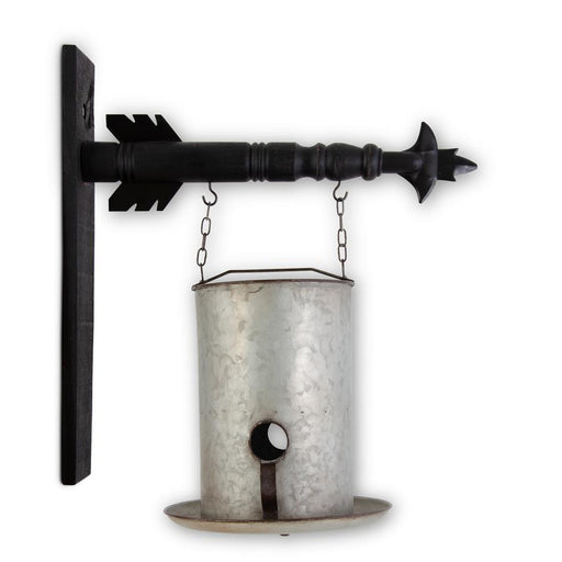 Decorative metal wall hanging with black arrow design on a white background