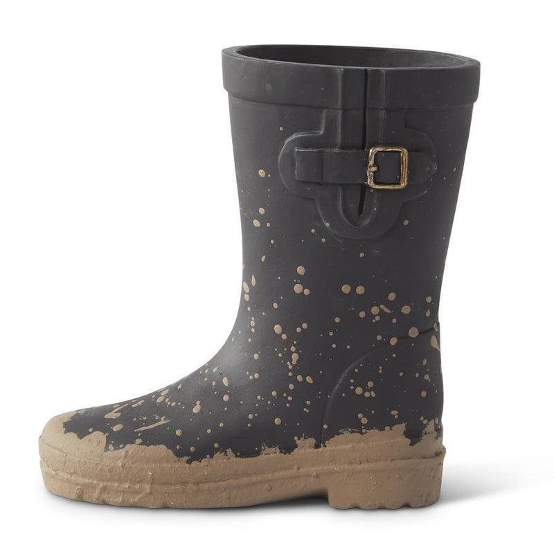 Black rain boot with beige splatter pattern and buckle on a white background