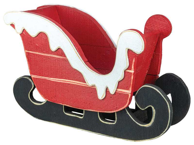A small decorative wooden sleigh ornament or figurine in red, black, and white, shown on a plain white background.