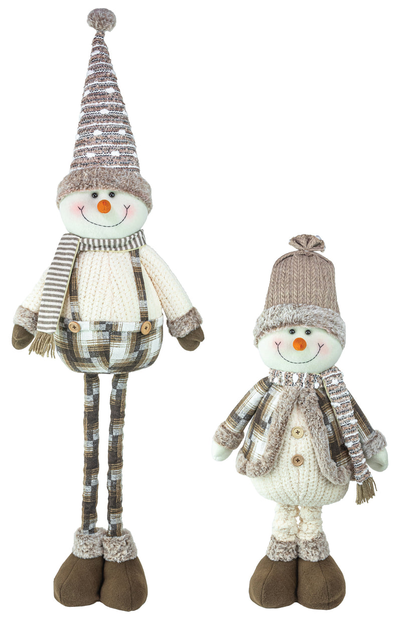 Two knitted snowman decorations in different sizes, featuring striped gray and beige hats, cream-colored sweaters, brown boots, and orange carrot noses, set against a plain white background.