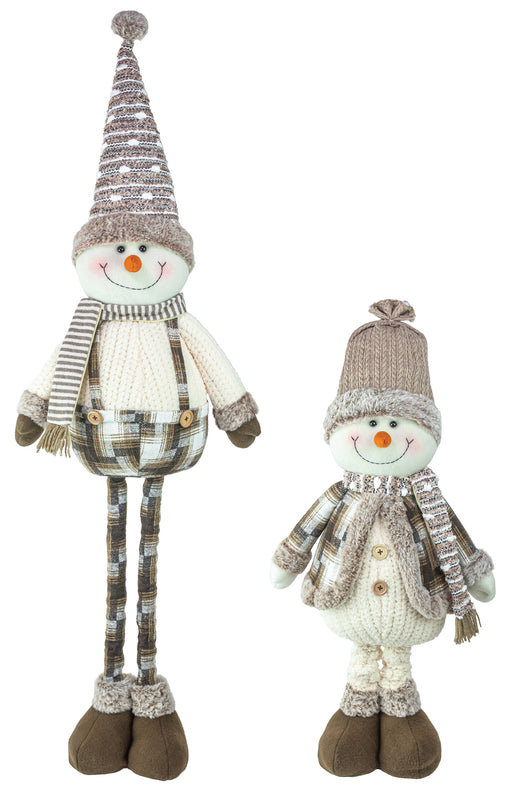 Two knitted snowman decorations in different sizes, featuring striped gray and beige hats, cream-colored sweaters, brown boots, and orange carrot noses, set against a plain white background.