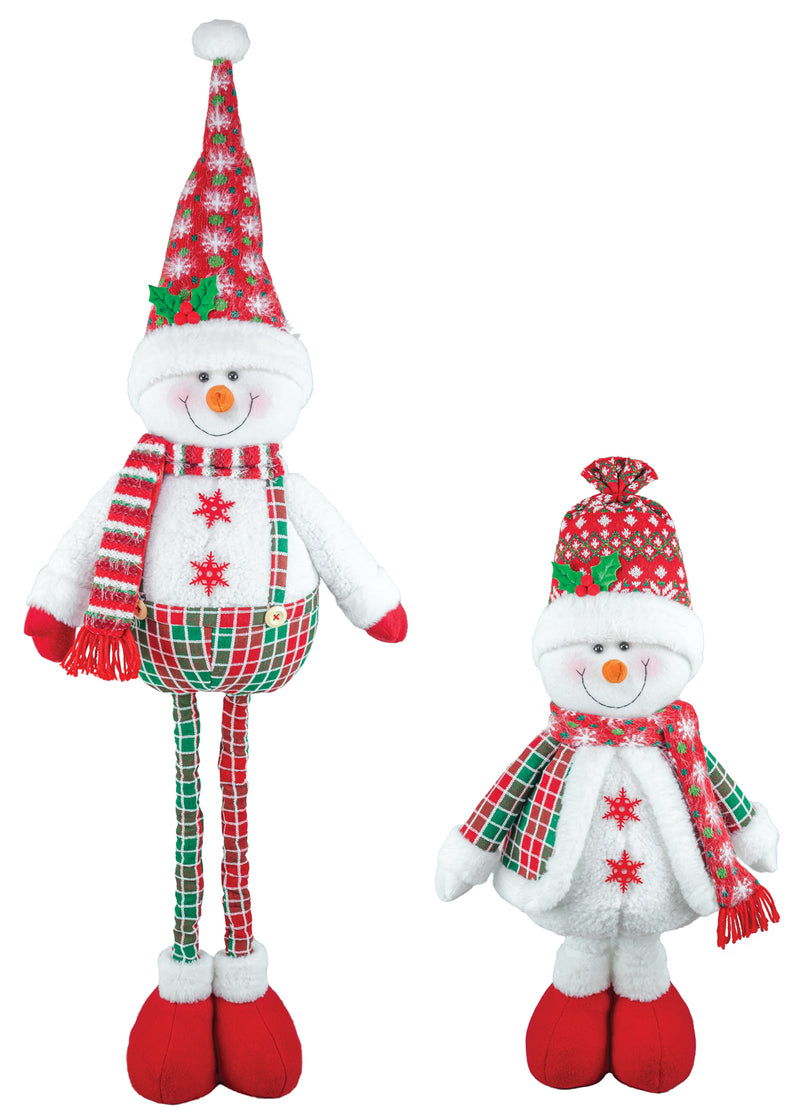 Two plush snowman Christmas decorations on a plain white background, one tall and one short, both wearing red and green holiday clothing with plaid patterns.