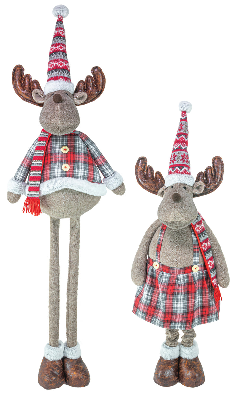 Two plush moose Christmas decorations on a white background, one tall and one short, both wearing red and green plaid outfits, patterned Santa hats, and brown antlers.