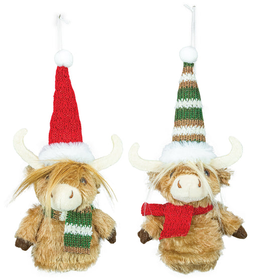 Two plush Highland cow ornaments hanging against a white background, each wearing a knitted Santa hat and scarf. One ornament has a red hat and scarf, and the other has a green, white, and tan striped hat with a red scarf.