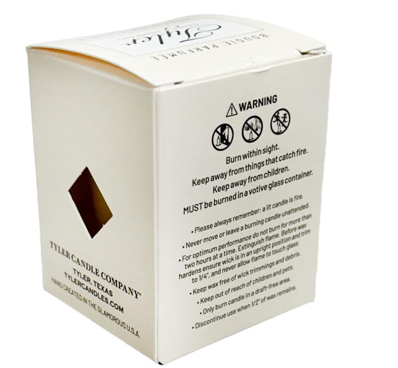 White candle box with warning label and Tyler Candle Company branding