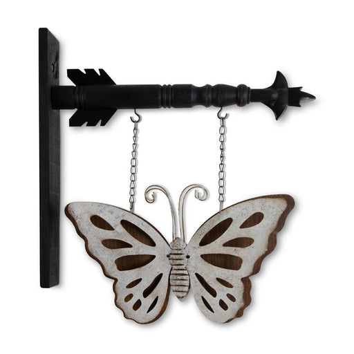 Decorative metal wall art with a butterfly and arrow on a white background