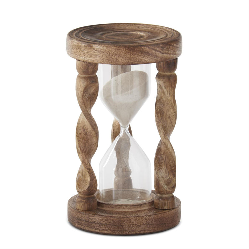 Wooden hourglass with sand on a white background