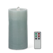 Frosted LED candle with remote control on a white background