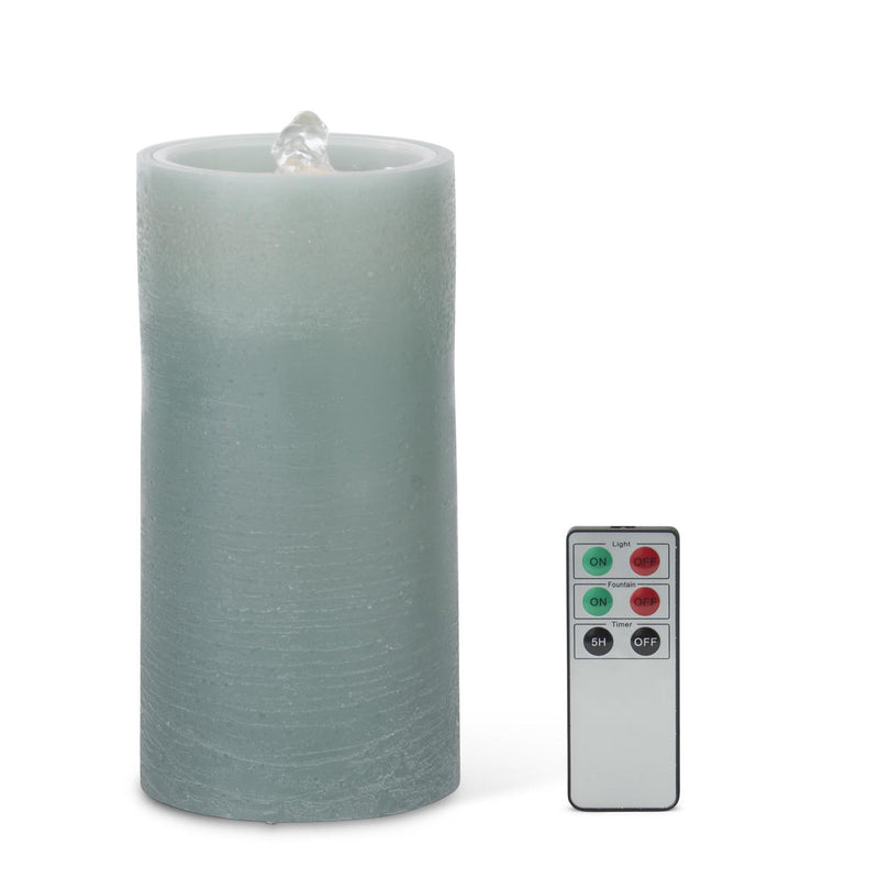 Frosted LED candle with remote control on a white background