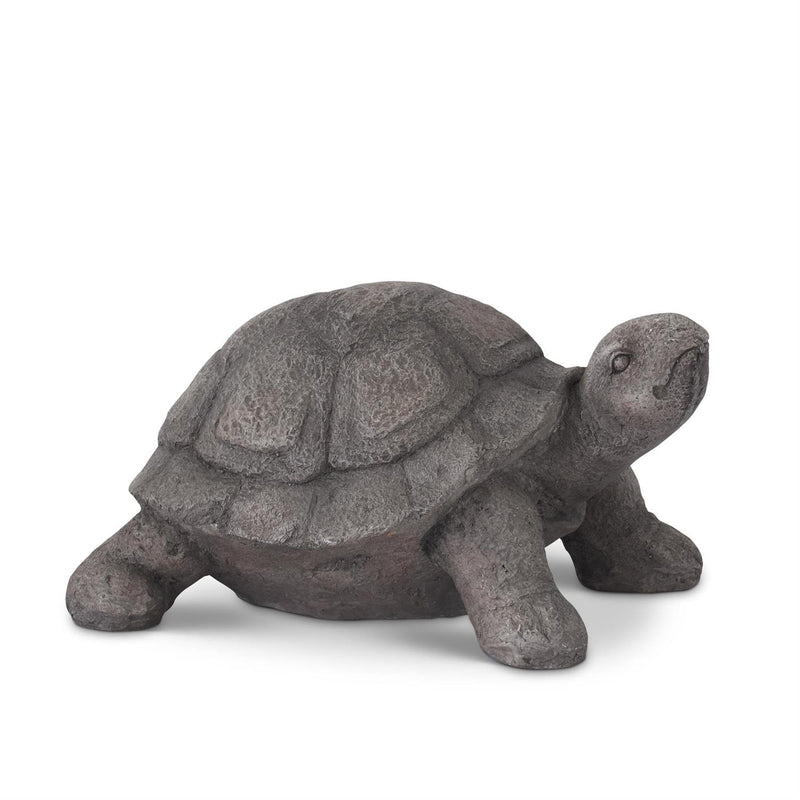 Stone turtle figurine on a white background