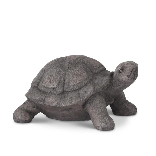 Stone turtle figurine on a white background