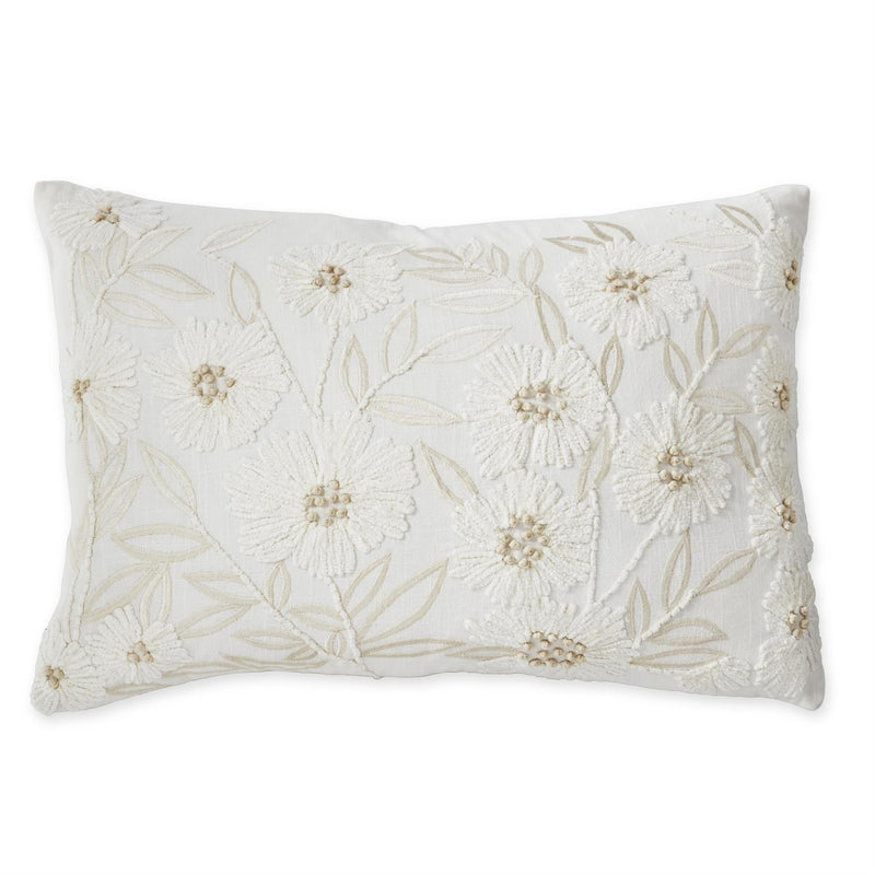 Decorative pillow with floral embroidery on a white background