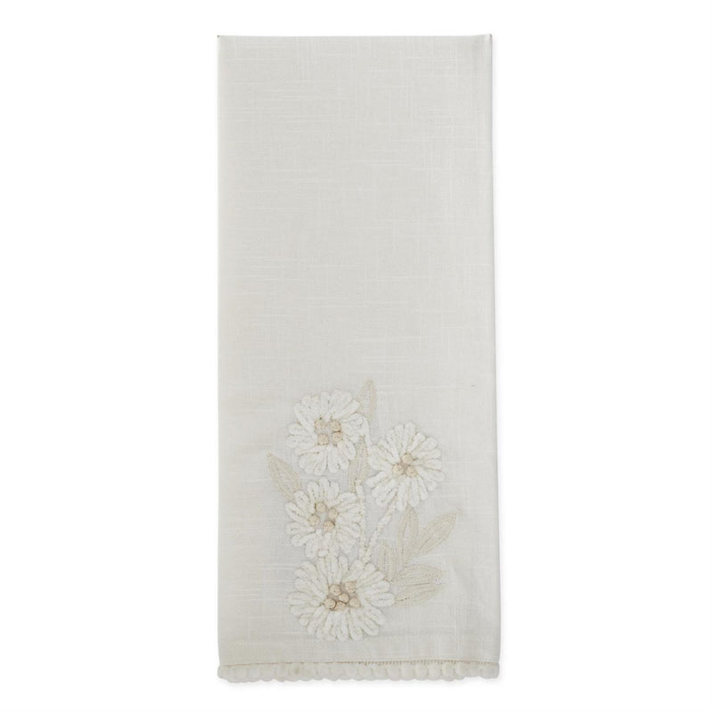 White towel with floral embroidery on a white background