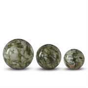 Three green marbled spheres of different sizes on a white background