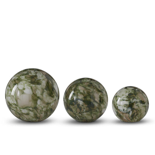 Three green marbled spheres of different sizes on a white background
