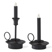 Two black colored LED candles with a metal decoration and a timer, displayed against a white background.