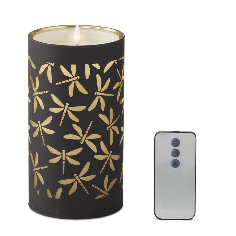 Black candle holder with gold dragonfly pattern next to a smartphone on a white background