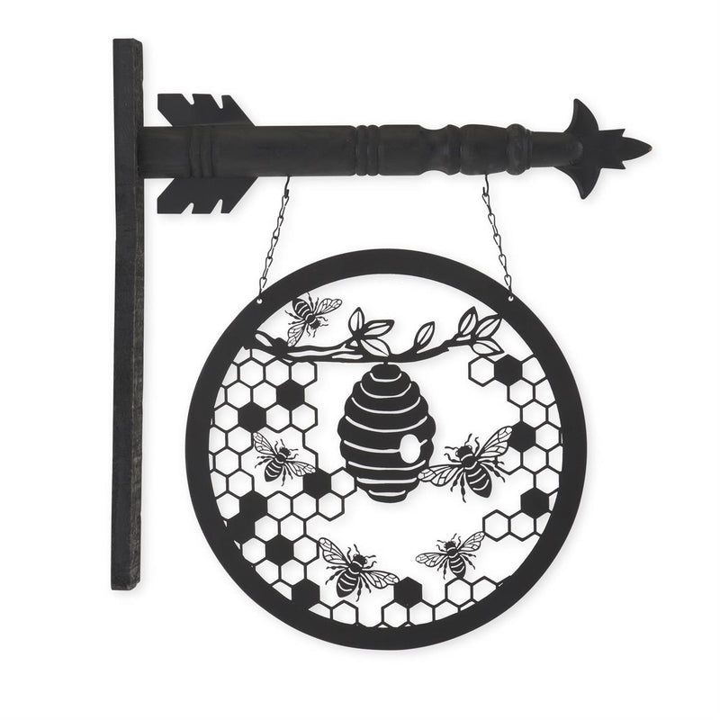 Decorative metal sign with bees, honeycomb pattern, and arrow on a white background