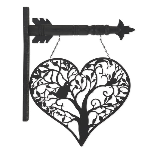 Decorative metal wall art with heart design and arrow on a white background