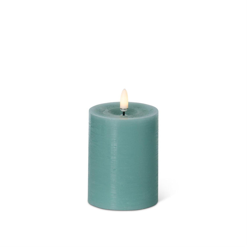 Green battery powered candle on a white background.