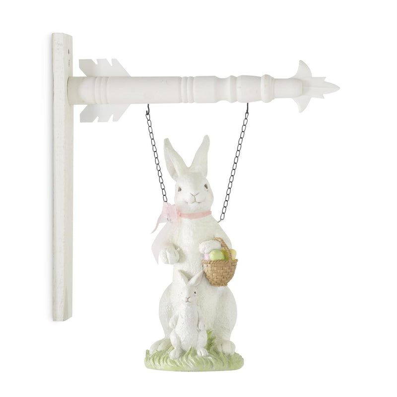 Decorative wall hanging with a white rabbit holding a basket, on a white background