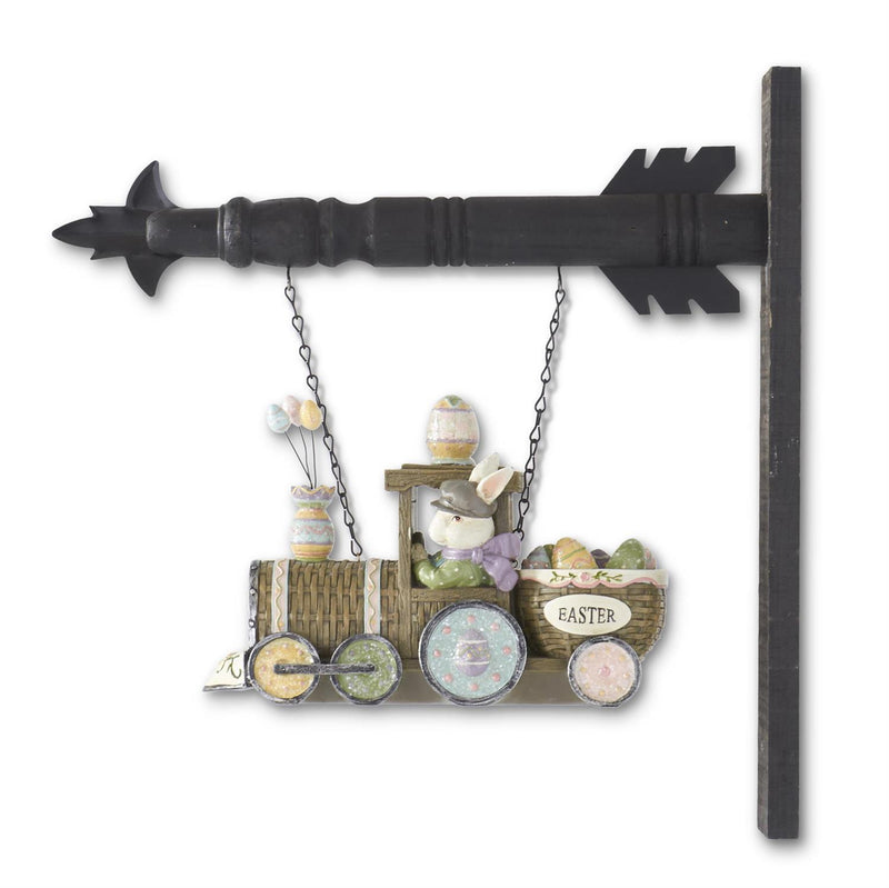 Decorative wall hanging with an arrow and Easter-themed train carriage on a white background