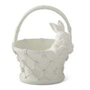 White ceramic basket with decorative patterns on a white background