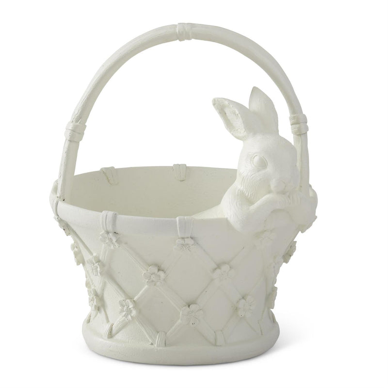 White ceramic basket with decorative patterns on a white background