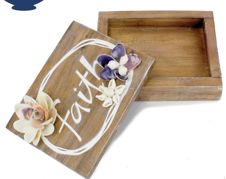 Wooden box with floral designs and the word 'Faith' on a white background