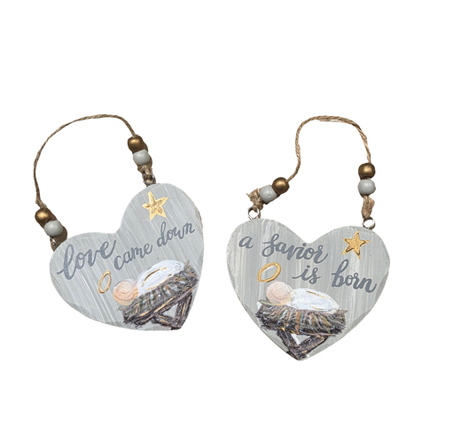 Two heart-shaped Christmas ornaments with text and star decorations on a white background