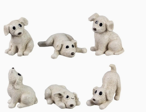 Set of six white dog figurines on a white background