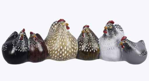 Set of glass chicken figurines in various colors on a white background