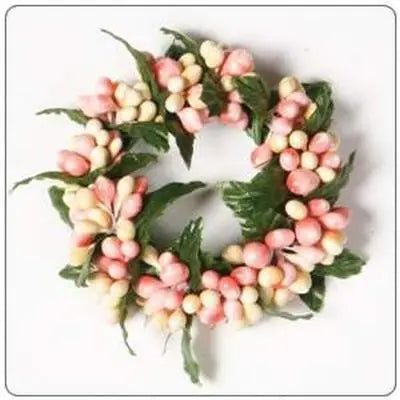 Decorative wreath with pink and white berries on a white background