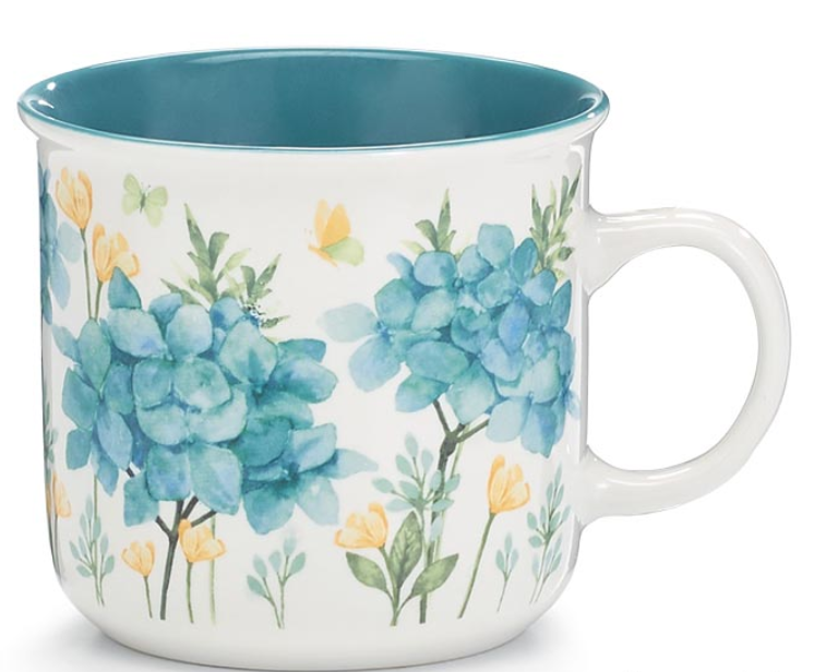 Mug with floral design featuring blue flowers and yellow tulips on a white background