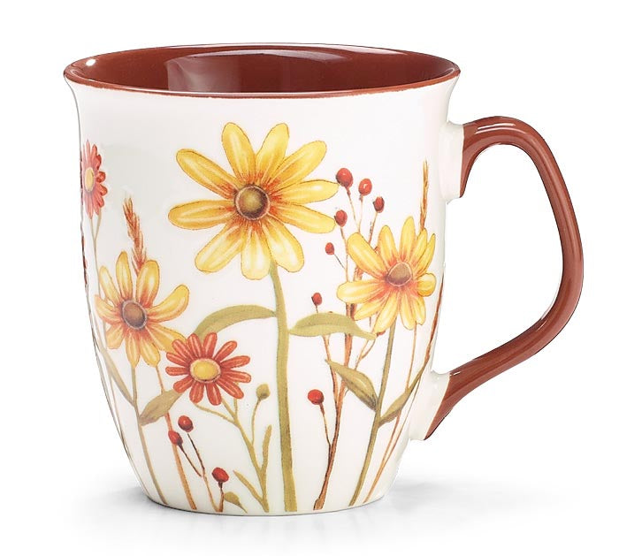 A white ceramic mug with a brown handle and interior, decorated with yellow and orange wildflower illustrations on a white background.